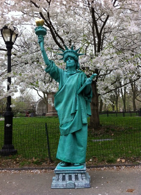 Statue of Liberty near Cherry Trees
