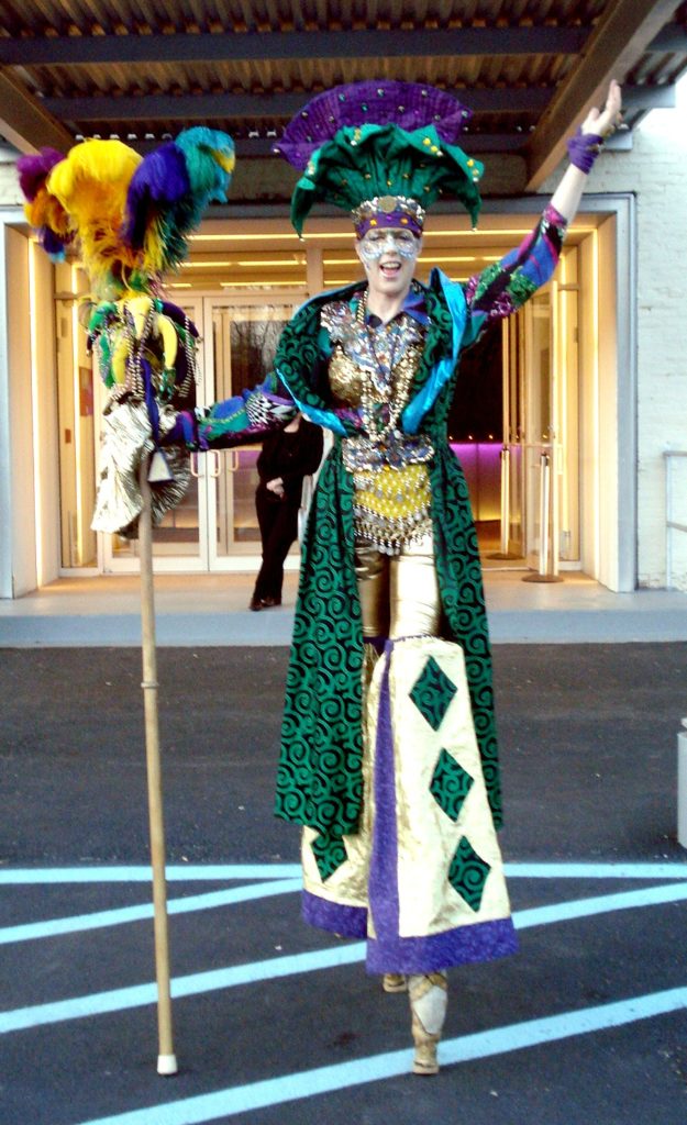 Penny England as Mardi Gras Queen on Stilts
