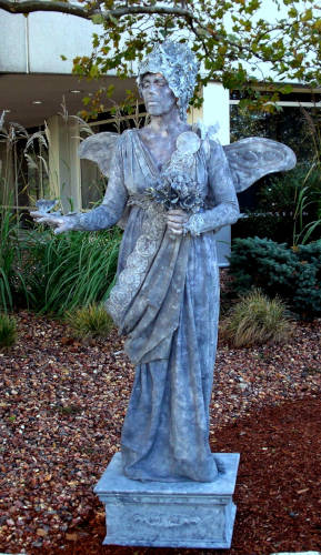 Penny-England as the Fairy Queen Statue with Wings